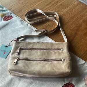 HOBO Leather Cream Crossbody Bag with Adjustable Strap and Copper Hardware